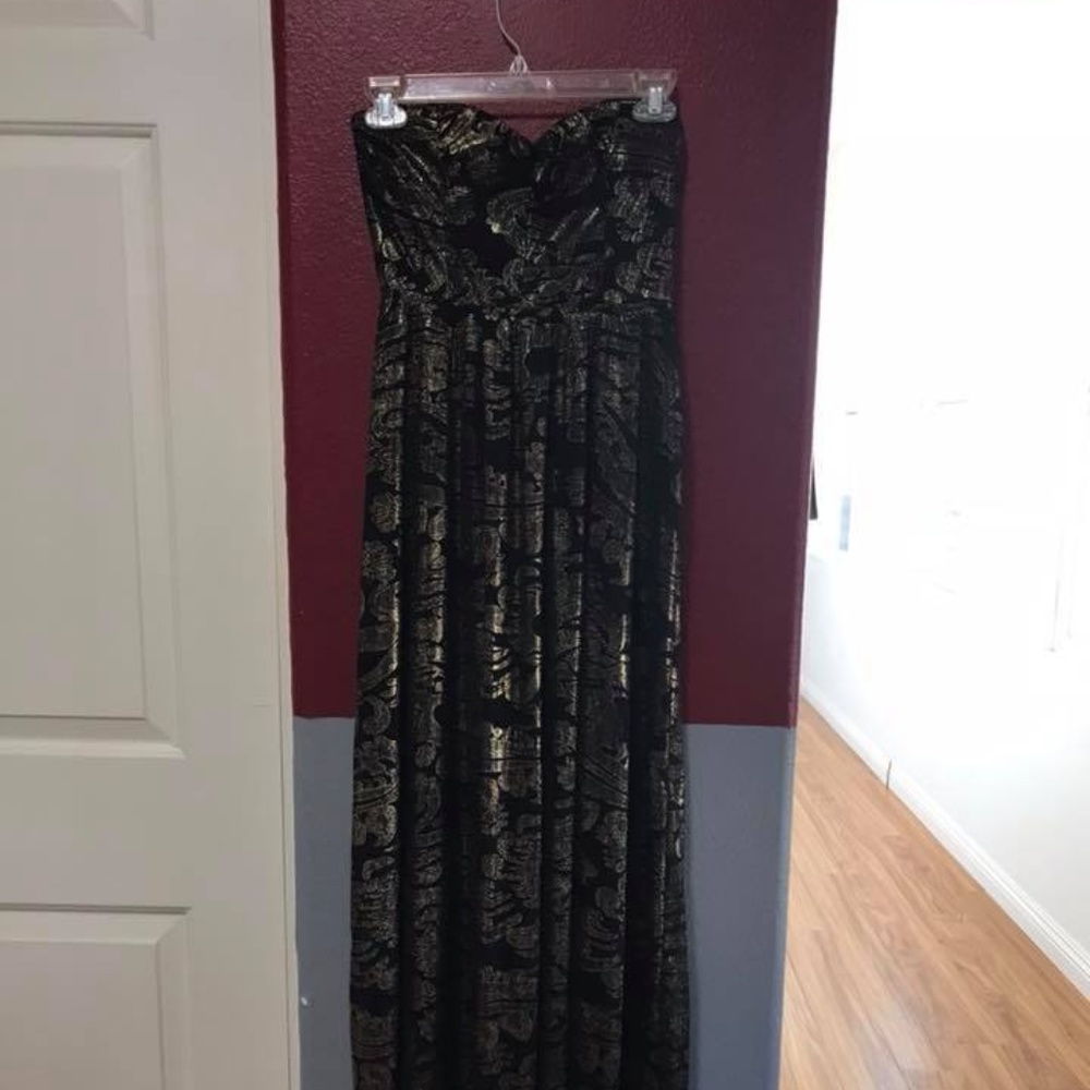 Black prom dress with gold glittery accents